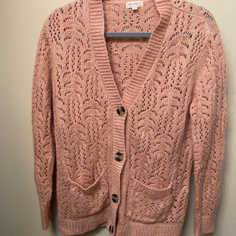 Pink sweater button